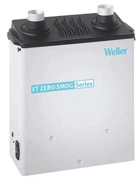 The image shows a white device with two tubes on top, used for air purification. It has a straight rectangular shape and the inscription "FT ZERO SMOG Series" on the front.