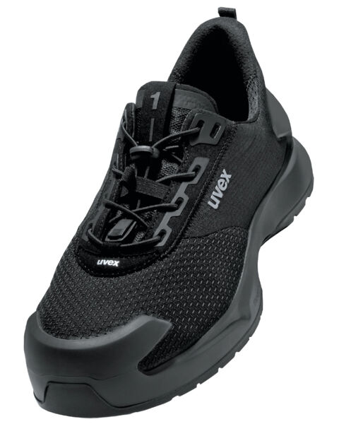 The shoe is a black, modern athletic shoe with a breathable mesh upper and a sturdy, non-slip sole. It features a sporty silhouette and reinforced toe protection.