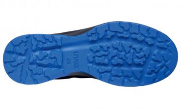 The underside of a shoe, primarily black with a blue, textured sole. The sole features various indentations and a rough tread for good grip.