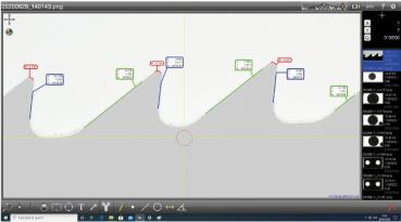 The image shows a technical view with multiple lines and markings, which may represent elevations or positions. The colors are blue and green, with symbols and numbers.