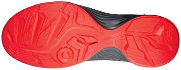 The image shows the sole of a sports shoe. The front part is red with a textured pattern, while the back part is black. The sole has a curved shape and a grippy texture.