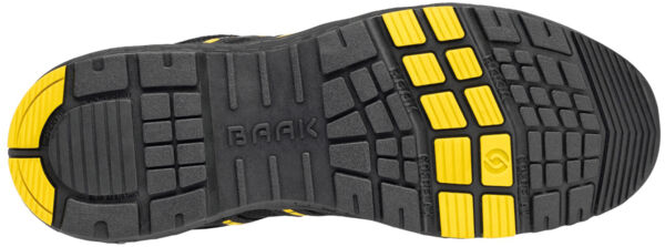 The image displays the sole of a shoe. It is predominantly black with yellow rubber elements. The sole features a textured tread with various grooves and patterns for good grip.