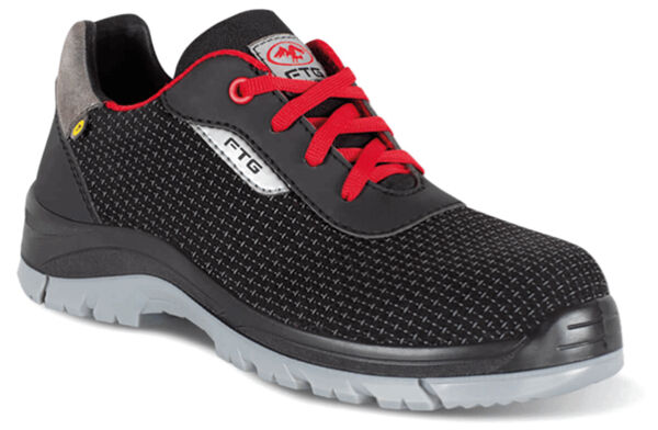 The shoe is black with red laces. It has a breathable surface and a grippy, gray sole. The heel is reinforced to provide support.