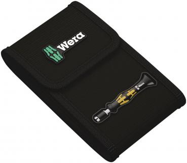 The image displays a black compact case from Wera with a zipper and a snap button. On the front, there is a Wera logo and a screwdriver depicted in yellow and black.