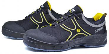 The image shows a pair of black safety shoes with yellow and gray accents. They feature a sturdy sole and a reinforced toe cap, ideal for work purposes.