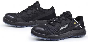 The image shows a pair of black athletic shoes. They are made from lightweight, breathable material with a non-slip, gray sole. The laces are also black, and a logo is visible on the side.