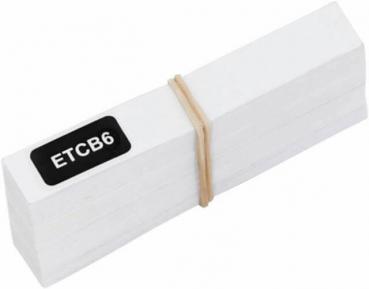 The image displays a stack of white, rectangular pieces of paper held together by a rubber band. One of the sheets has a black label with the inscription "ETCB6".