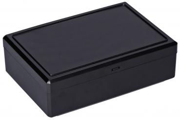 It is a rectangular, flat box in black. It has a smooth, deliberate lid and a simple, modern shape. The surface is glossy and slightly reflective.