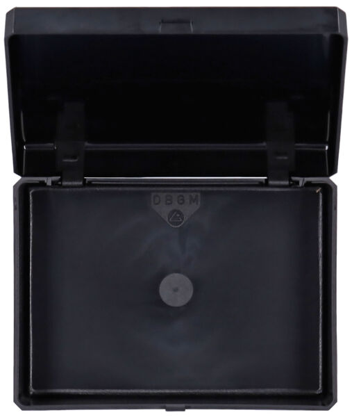 The image shows a black, rectangular box with a foldable lid that is open. Inside, the box is also black and has a small round button in the center.