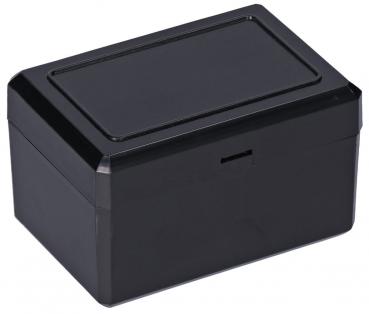 A rectangular box made of black plastic with a smooth lid. It has rounded edges and a simple, elegant shape. There is a narrow slot on the front.