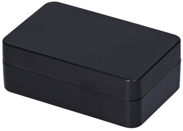 The image shows a rectangular, matte black box with rounded edges. It has a smooth, uniform surface finish and appears simple and modern.