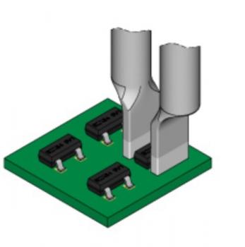 The image shows a green circuit board with two metallic connectors in the middle and four black components underneath, which are mounted on the board.