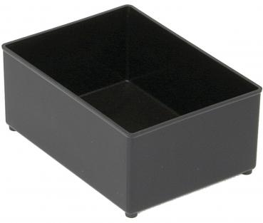 The image shows a rectangular, flat box made of black plastic. It has a smooth surface and slightly rounded corners. The box has small feet on the bottom.