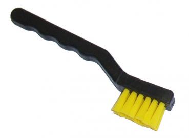 The image shows a small cleaning brush with a black handle and yellow bristles. The handle is ergonomically shaped and the bristles are densely arranged.