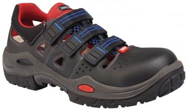 The shoe is black with gray and red accents. It has a sporty look and three buckles for adjustment. The sole is sturdy, with a grippy pattern for good traction.