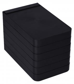 The image shows several black, rectangular stackable boxes. They are flat and stacked on top of each other, with only the top one slightly tilted forward.