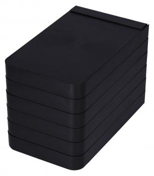 The image shows a stack of flat, black containers. They are rectangular with rounded corners and stacked on top of each other, so that only the top is visible.