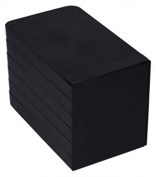 The image displays a black cuboid, flat and without any distinctive decorations. It has slightly rounded corners and is standing on one of its longer sides. The surface is smooth.