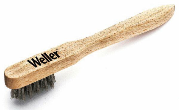 The image shows a brush with a long wooden handle. The bristles are gray and soft. The handle features the inscription "Weller". The brush appears sturdy and handy.