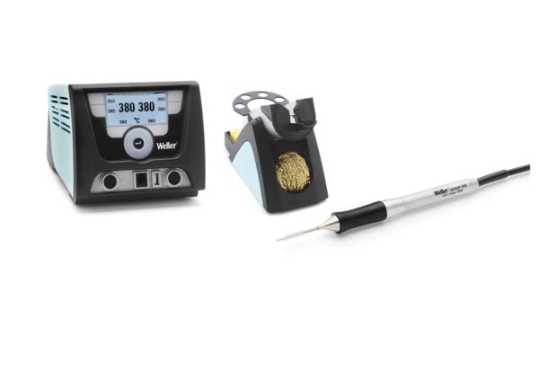 The image displays a soldering iron kit. On the left is a digital soldering iron controller with a display, on the right a soldering iron and a holder with a wire brush.