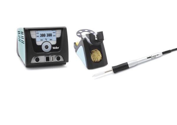 The image shows a soldering iron set. On the left, a digital soldering iron with a display, in the middle a cleaning sponge, on the right a soldering tool with an ergonomic handle.