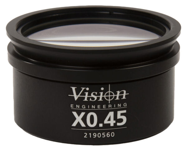 The image displays a black lens or objective in a round casing. The front reads "Vision Engineering X0.45" along with a sequence of numbers. The surface is smooth and glossy.