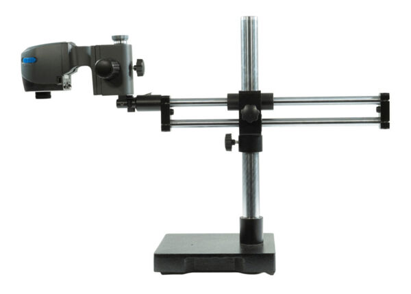 The image shows a device for measuring eyes. It has a horizontal and vertical bar, on which an optical measuring instrument is attached. The base is stable and square.