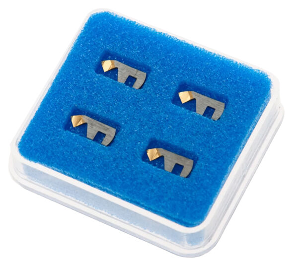 The image shows a transparent box with a blue foam insert. Inside, there are four metallic parts that are L-shaped and gold-colored on one side.