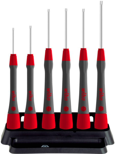 The image shows a set of six screwdrivers in various sizes. The handles are black with red accents. They are standing on a black holder.