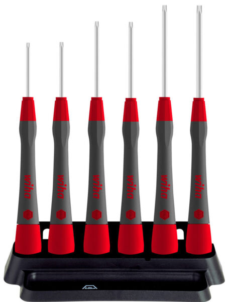 The image shows six screwdrivers with red handles and silver blades, standing on a black stand. The handles are ergonomically shaped and have a non-slip surface.