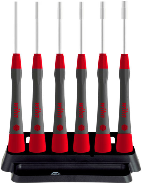 The image shows a stand with six electric toothbrushes. Each brush has a red handle and a gray design. They are mounted on a stable black base.