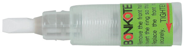 The image shows a small, transparent bottle with a white applicator. There is a green label on the bottle with instructions and the word 