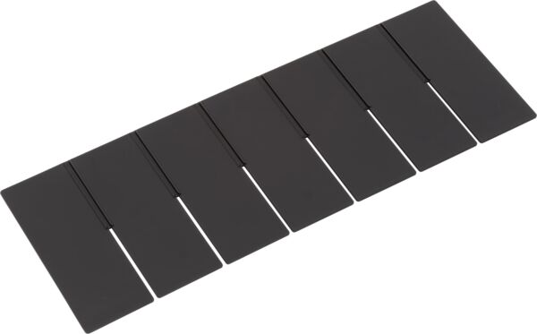 The image shows a flat, rectangular object made up of several equally-sized, narrow black tiles. Each tile has a slight notch on one side.