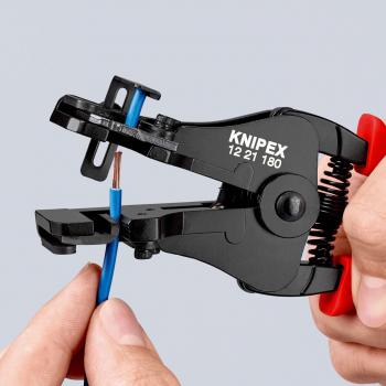 The image shows an electric cable cutter in a hand. The cutter is black with red handles and is holding a blue cable. The tool has "KNIPEX" written on it.