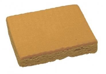 The image shows a rectangular, sponge-like object in a warm yellow hue. The surface is slightly rough and uneven, with a thicker edge on one side.