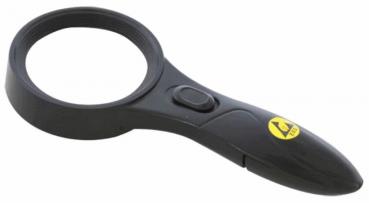 The image shows a black magnifying glass lamp. It has a large, round glass area and an elongated handle with a button. A yellow symbol is attached to the handle.