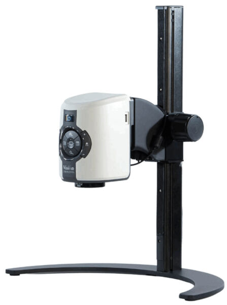 The image shows a compact projector with a white casing, mounted on a black, sturdy stand. The projector has control buttons on the front.