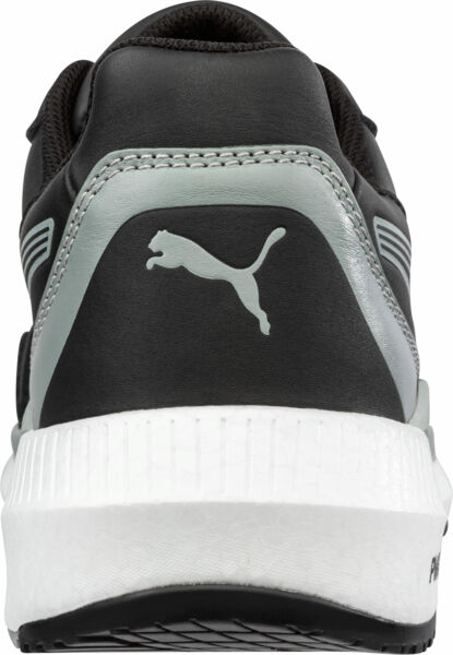 The image shows the rear view of a black sports shoe with gray accents. A puma logo is depicted on the heel. The sole is white and slightly elevated.