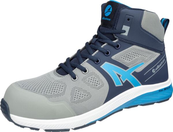 The shoe is a mid-top sports shoe in gray and blue. It features a breathable upper with mesh inserts and a thick, grippy sole that provides stability.