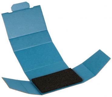 The image shows a blue and white cardboard package that is open. In the center lies a black, rectangular piece of material, presumably foam.