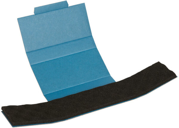 The image displays a blue, centrally folded piece of cardboard with a black, elongated adhesive area. The cardboard is open and reveals the adhesive strip.