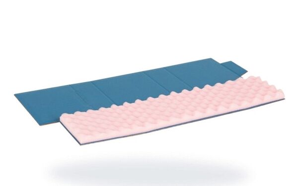 The image shows a folded sleeping pad with a wavy, pink surface on top and a smooth, blue side on the bottom. The mat is lightweight and suitable for outdoor activities.