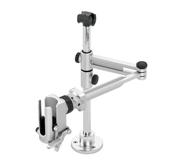 The image shows a silver, adjustable mounting arm. It has a base, a vertical stand, and a device holding clip attached to a joint.