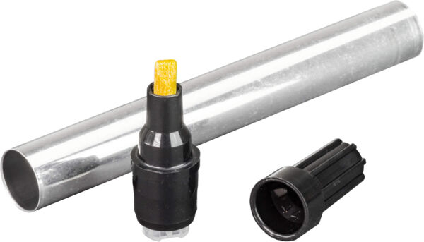 The image shows three objects: a metallic cylinder, a black marker with a yellow tip, and a black cap. The cylinder is lying horizontally, while the other items are placed beside it.