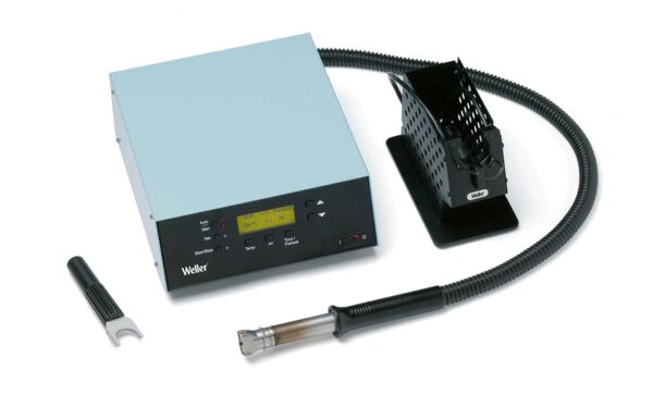 The image shows a soldering station with a blue casing, a digital display, and controls. Next to the station is a soldering tool with a flexible cable and a storage station made of black wire mesh.