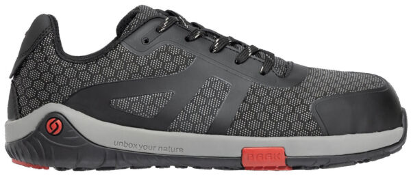 The shoe is sporty, predominantly black with a textured, checkered pattern. It has lined eyelets, a gray sole, and a red accent on the heel area.