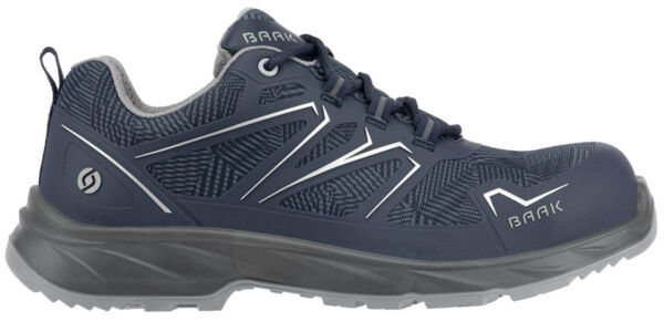 The shoe is a sporty, dark blue sneaker. It has a textured surface with light, graphic patterns and reflective elements. The sole is thick and grippy, ideal for outdoor activities.