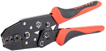 The image shows a black crimping tool with red handles. The tool has a clampable opening and various holes for crimp connections. It appears sturdy and ergonomically designed.