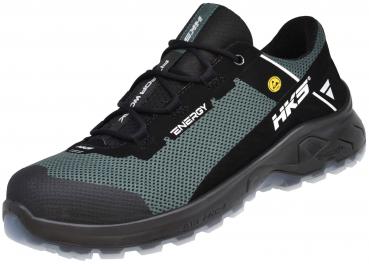 The shoe is a sporty, lightweight trail shoe. The colors are black and dark green with mesh-like inserts. The sole is sturdy and provides good grip on uneven terrain.