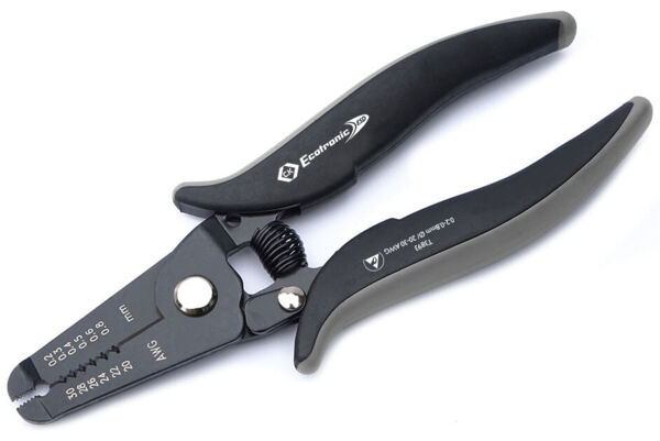 The image shows a black pair of pliers with ergonomic handles. It features a serrated edge and an adjustable scale for different wire diameters. The pliers appear sturdy and functional.